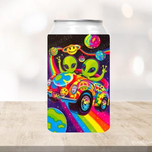 May include: A colorful can cooler featuring two green aliens driving a psychedelic van with a peace sign on the side. The van is driving through a rainbow and stars. The can cooler is perfect for keeping your drinks cold.