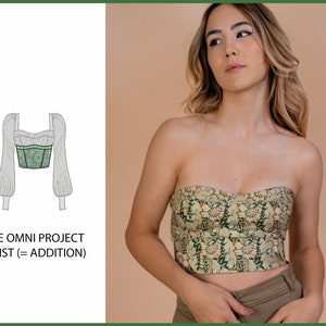 May include: A green and white floral print crop top with a strapless design. The top has a fitted bodice and a slightly cropped length. The text "THE OMNI PROJECT WAIST (= ADDITION)" is visible in the image.