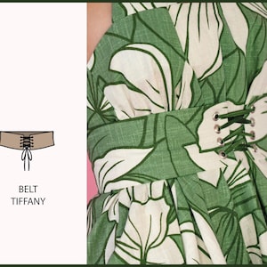 May include: A brown leather belt with a lace-up front. The belt is called "Tiffany".