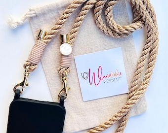 Phone chain made of twisted rope. Beige. Smiley face charm. Gold.