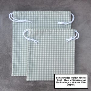 Handmade drawstring bags in a light sage green gingham cotton rich canvas fabric with white cotton braided cords.

Small with drawcord - 30cm x 26cm 
Medium/large with drawcord - 36.5cm x 33cm
