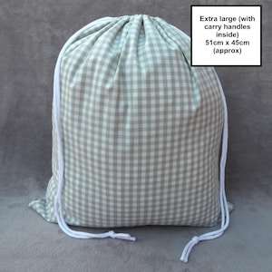 Handmade laundry bag in a light sage green gingham cotton rich canvas fabric with white cotton braided cords.

Extra large with drawcord and carry handles - 51cm x 45cm