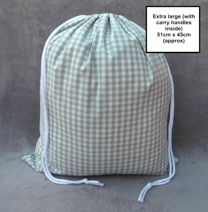 Handmade laundry bag in a light sage green gingham cotton rich canvas fabric with white cotton braided cords.

Extra large with drawcord and carry handles - 51cm x 45cm