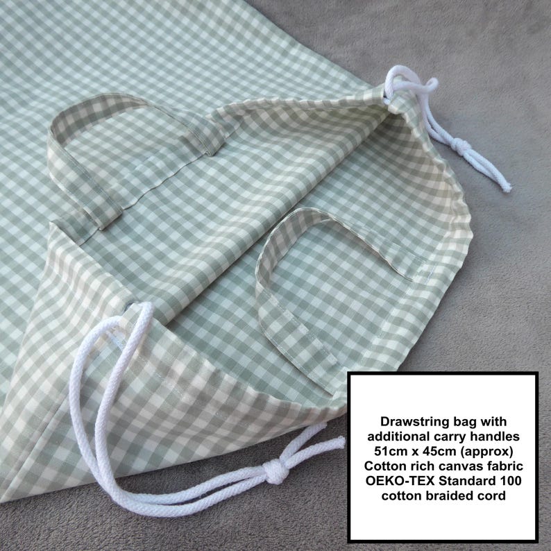 Handmade laundry bag in a light sage green gingham cotton rich canvas fabric with white cotton braided cords. Extra large with drawcord and carry handles - 51cm x 45cm