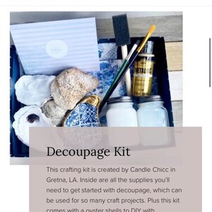 May include: A decoupage kit with oyster shells, metallic gold paint, and brushes in a wooden box. The kit is created by Candle Chicc in Gretna, LA. The text "Decoupage Kit" is written in a white font on a brown background.