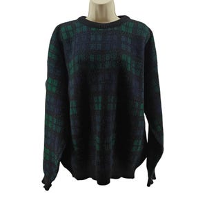 May include: A long-sleeved sweater with a plaid pattern in shades of navy blue, green, and black. The sweater has a crew neck and a classic, comfortable fit. The pattern is a repeating grid design.