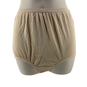 May include: Beige high-waisted briefs featuring a smooth, solid-colored fabric with a subtle sheen. The garment includes a thin, elasticized waistband and leg openings finished with a delicate, decorative picot trim along the edges.