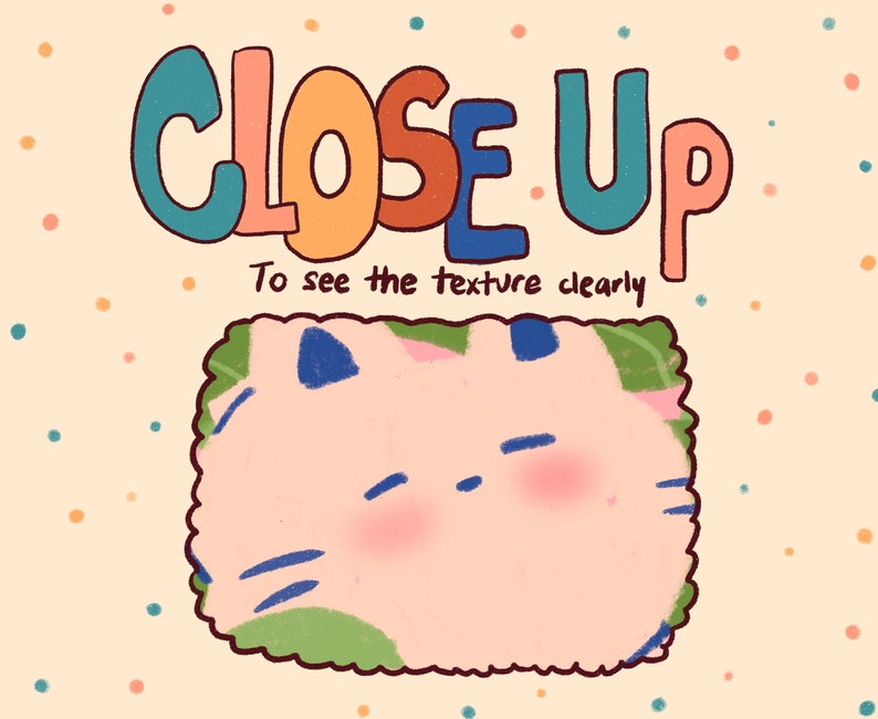 May include: A close-up image of a cartoon cat with a pink body, blue eyes, and green and blue markings. The text "CLOSE UP" is written in colorful letters above the cat. The text "To see the texture clearly" is written below the cat.