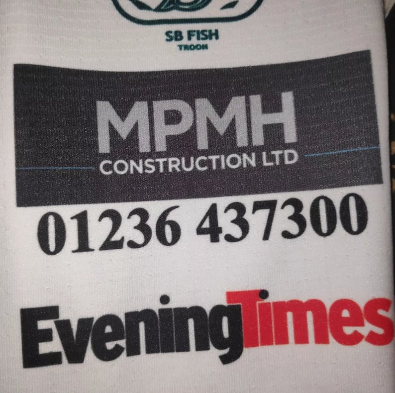 May include: A white background with black text that reads "MPMH Construction LTD" and a phone number "01236 437300". Below the phone number is the text "Evening Times" in black and red.