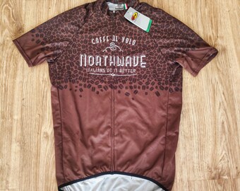 May include: A brown cycling jersey with a white coffee bean pattern and the text "Caffe al Volo Northwave Italians do it better".