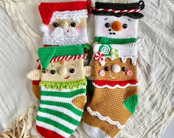 May include: Four crocheted Christmas stockings with different characters: Santa Claus, a snowman, a gingerbread person, and an elf. The stockings are all white with different colored accents and details.
