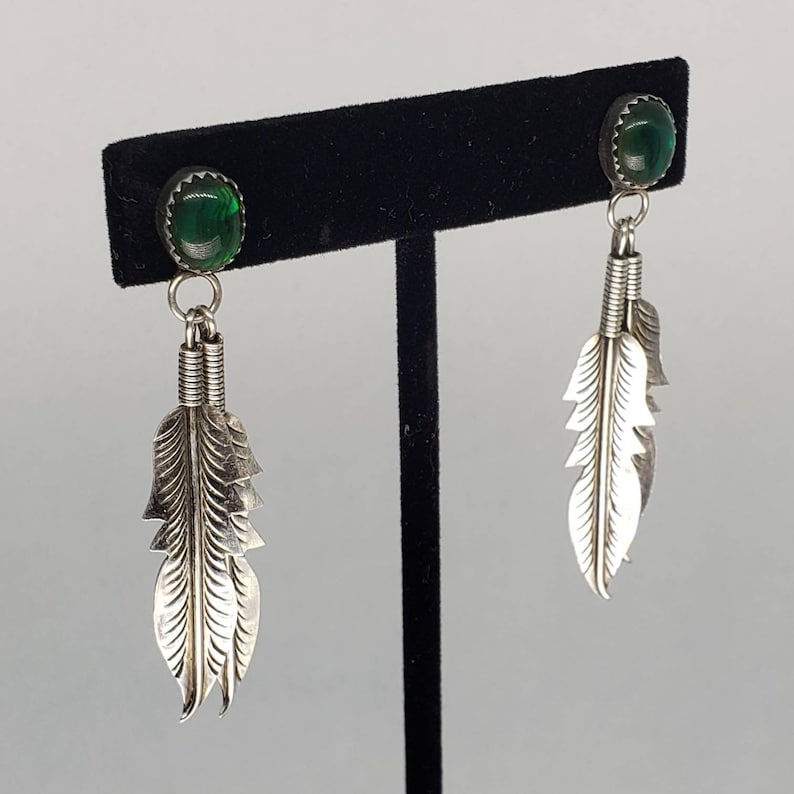 Silver Dangling Feather Earrings with Green Stones