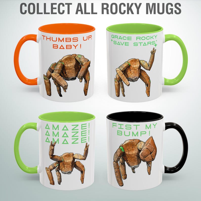 May include: Four white ceramic mugs with colorful handles and interiors. Each mug features a unique illustration of a brown, rock-like creature with different poses and phrases like "Thumbs Up, Baby!" and "Fist My Bump!" The text "Collect All Rocky Mugs" is at the top.