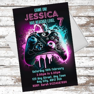 May include: A birthday party invitation featuring a neon pink and blue video game controller graphic. The text reads "Game On! Jessica Has Reached Level 7". The invitation includes the date, time, and location of the party.