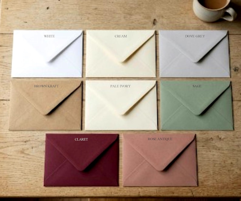 May include: A collection of eight rectangular envelopes in various colours, each labelled with its shade: White, Cream, Dove Grey, Brown Kraft, Pale Ivory, Sage, Claret, and Rose Antique. The envelopes are arranged in a grid, each featuring a triangular flap.