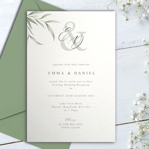 May include: A white wedding invitation with green foliage and the text "ED" in a script font. The invitation announces the wedding reception of Emma and Daniel on Saturday, August 26th, 2023 at 7:30pm at the Lake View Hotel in Walton, Wakefield, W72 9L8. RSVP by May 20th, 2023.