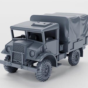 May include: A gray vintage military truck model with a canvas top. The truck features a detailed front grille, headlights, and rugged tires. The vehicle has a classic design, suggesting a historical or collectible theme.