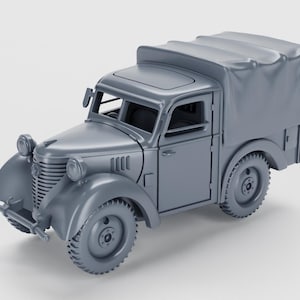 May include: A grey vintage pickup truck model with a canvas-covered rear. The truck has a detailed front grille, headlights, and mudguards. The wheels have a rugged tread design, and the vehicle has a classic, retro aesthetic.