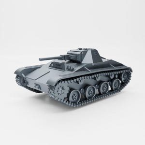 May include: A gray model of a military tank with a detailed design. The tank has a long barrel and tracks on the bottom.