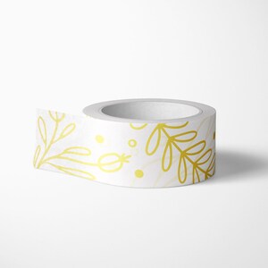 May include: A roll of white washi tape with a gold floral pattern. The tape features delicate branches and leaves with a subtle shimmer.