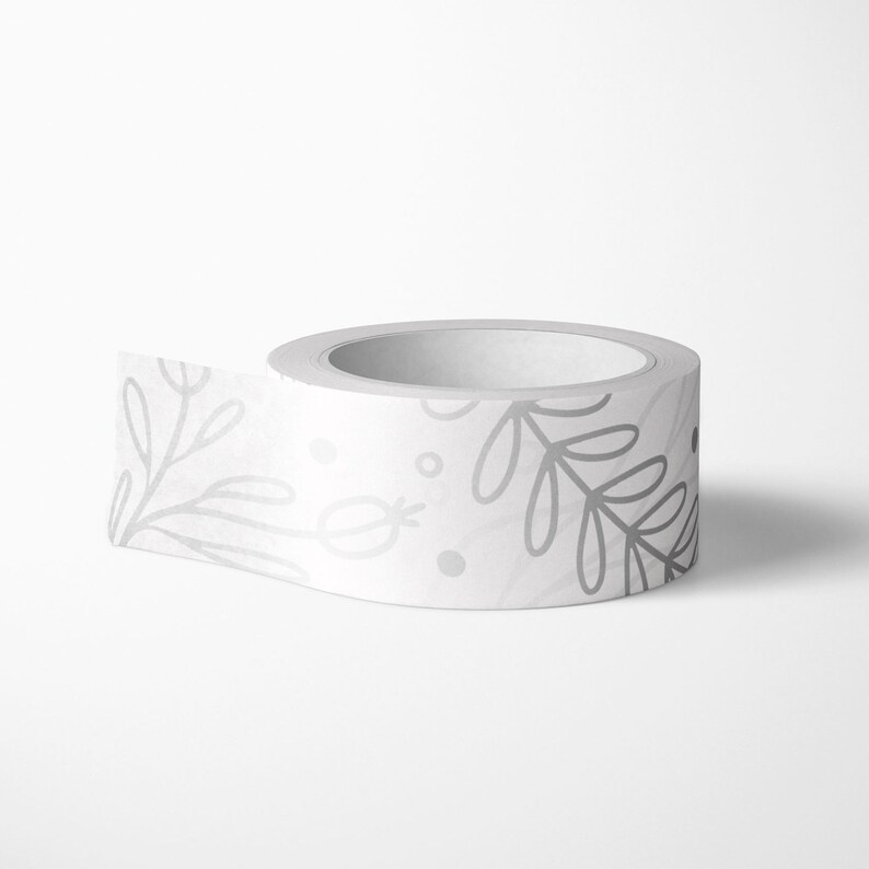 May include: A roll of white washi tape with a silver floral pattern. The tape is rolled up and ready to be used.