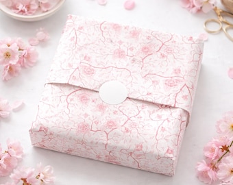 Komposterbart silkespapper med körsbärsblommor och rosa blommor