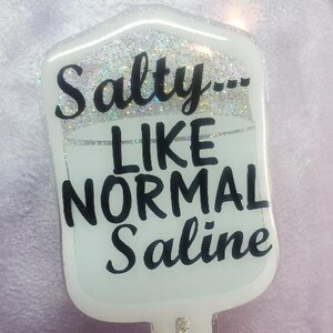 Badge Reel - Salzig wie normale Kochsalzlösung