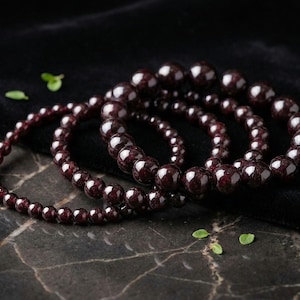 This deep burgundy colour handmade beaded gemstone bracelet is made from genuine Garnet 4-6-8-10mm beads