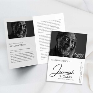 May include: A black and white photo of a man with a kind smile. The photo is on a black and white memorial card with the text "In Loving Memory Jeremiah Thomas March 17, 1970 - March 2, 2023" and the date and time of the memorial service.