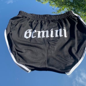 Black custom zodiac booty shorts