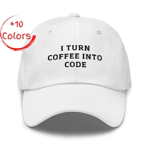 May include: White baseball cap with the text "I TURN COFFEE INTO CODE" in black. The cap has a curved brim and an adjustable strap. A red circle with the words "+10 Colors" is in the upper left corner.