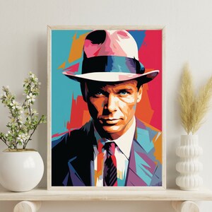 May include: A colorful pop art style portrait of a man wearing a pink fedora hat and a blue suit with a patterned tie. The background is a mix of red, orange, yellow, and blue.