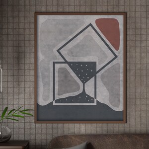 Puede incluir: Un juego de tres tazas de cerámica con un acabado moteado y mate. Las tazas son de color crema, gris claro y gris oscuro. Cada taza tiene un diseño simple y minimalista y un asa redondeada. Las tazas están apiladas una encima de otra.