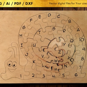 May include: A wooden puzzle shaped like a snail with a spiral shell. The shell is divided into 10 puzzle pieces, each with a letter of the alphabet and a number. The snail's body is also divided into puzzle pieces, each with a number. The puzzle is made of light brown wood.