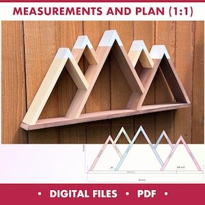 Puede incluir: Estantería de madera con forma de montaña de tres picos, pintada de blanco en la parte superior. La estantería está montada en una pared de madera. La imagen incluye un diagrama con medidas: 91,4 cm de ancho, 38,1 cm de alto y 1,6 cm de grosor.