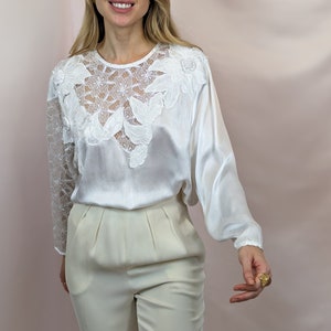 True vintage 1980s pearl white 100% viscose romantic asymmetric blouse with lace panel and appliques glam chic size S/M