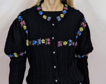 True vintage 1980s hand knitted 100% wool Austrian folk black cardigan with puff sleeves and floral embroidery size M