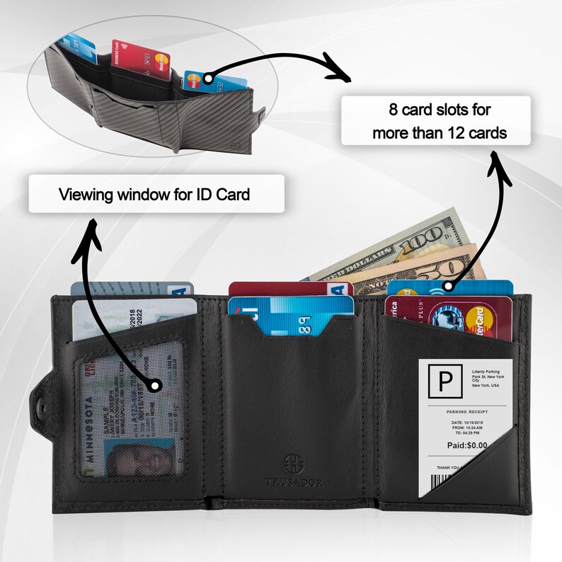 May include: Black leather trifold wallet with 8 card slots, a viewing window for an ID card, and a separate compartment for cash or receipts. The wallet is open to show the interior and the text "TRUSADOR" is visible on the front.