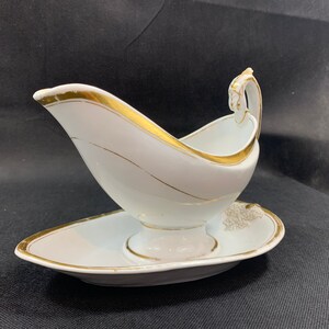 Antique sauce bowl with gold rim