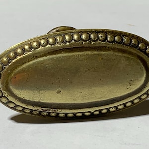 Old oval brass doorknob with beaded rim – vintage brass furniture knob – antique door or cabinet hardware