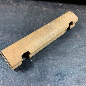 Iron Handle - Antique wooden handle for taking a hot iron from the stove.