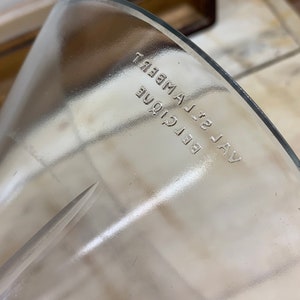 May include: A clear glass funnel with the text "VAL 32 BELCIQUE LAMBERT" printed on the side.