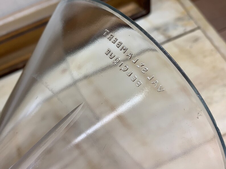 May include: A clear glass funnel with the text "VAL 32 BELCIQUE LAMBERT" printed on the side.