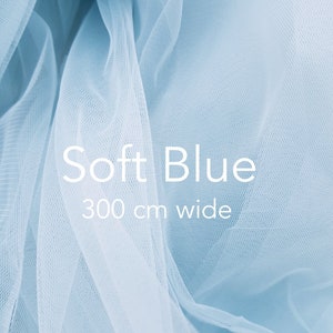 May include: Soft blue tulle fabric, 300 cm wide. The fabric is sheer and delicate, with a soft, flowing texture.