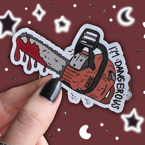 May include: A white sticker with a red and black chainsaw with dripping blood and the text "I'm Dangerous" in black.