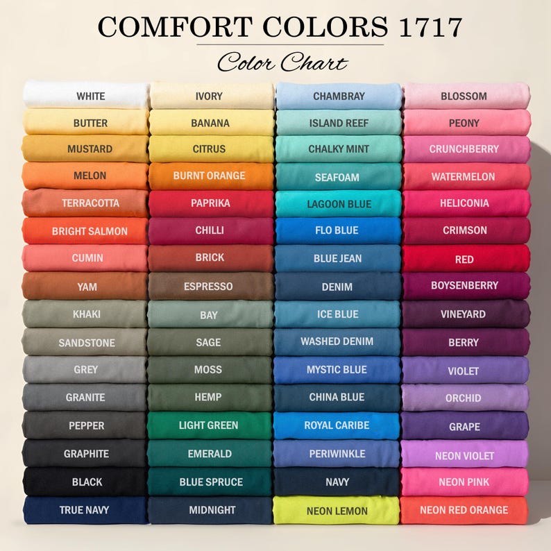 May include: A Comfort Colors 1717 color chart displaying four vertical columns of folded fabric swatches in various shades. Each swatch is labeled with its corresponding color name, ranging from white, yellow, and orange to blue, pink, and purple.