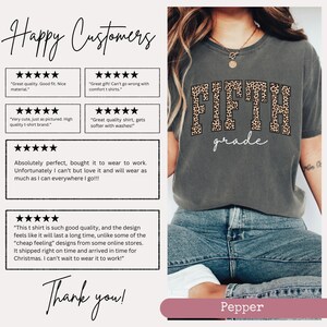 May include: A gray t-shirt with a leopard print design that says "FIFTH grade" in white text. The shirt is being worn by a person with blue jeans. The image includes customer reviews praising the quality and fit of the shirt.