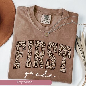 Comfort Colors® Leopard First Grade Teacher Shirt, 1st Grade Teacher Shirt, First Grade Shirt, Elementary School, Teaching Shirt Espresso-white text