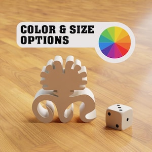 Puede incluir: Escultura abstracta blanca con una rueda de colores colorida en el fondo. El texto "COLOR & SIZE OPTIONS" está por encima de la rueda de colores. Un dado blanco con puntos negros está en primer plano.