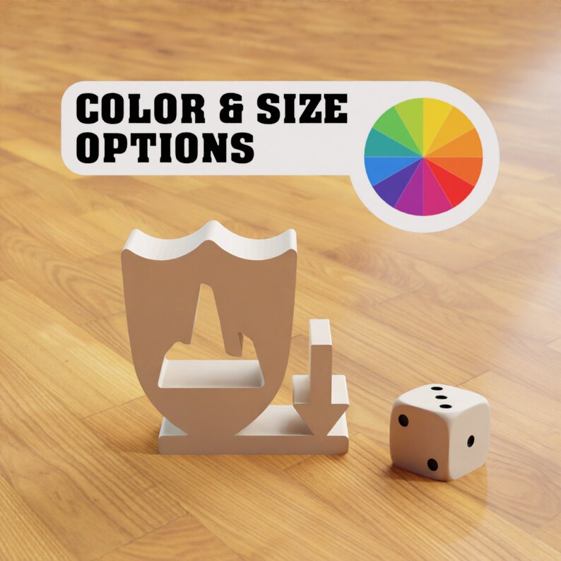 May include: A white shield with a mountain peak inside, a white arrow pointing down, and a white dice with black dots. The text "COLOR & SIZE OPTIONS" is on a white banner with a rainbow color wheel.